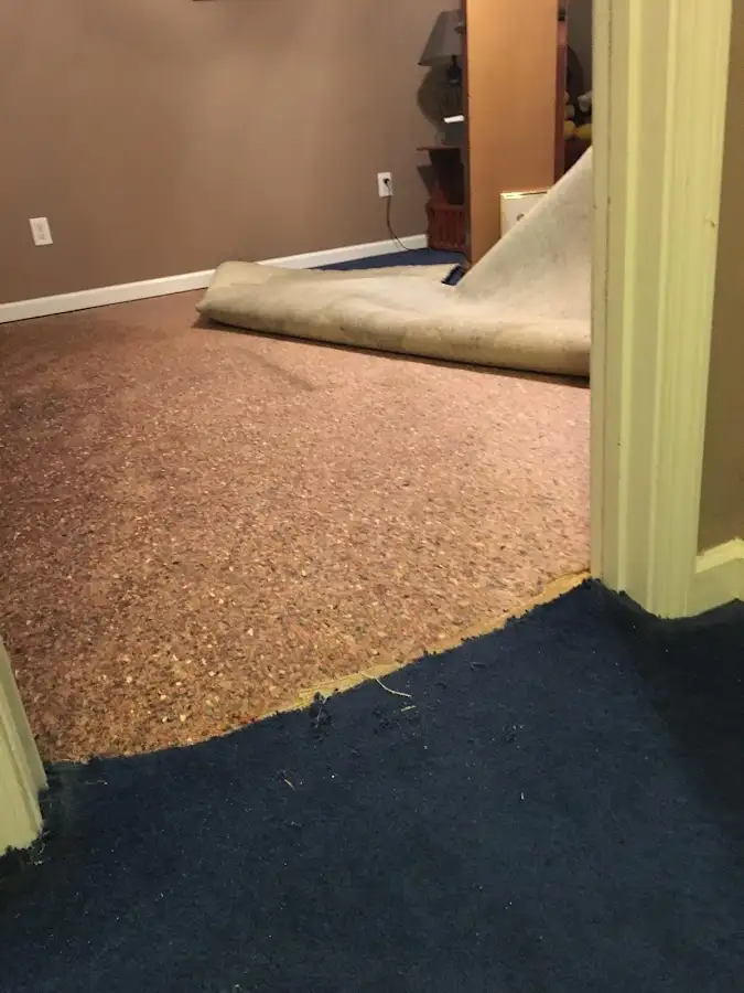 Carpet pad removal revealing water damage during Water Mitigation Services in Ceres