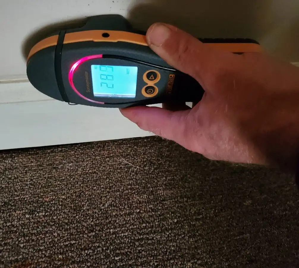 Moisture detection at baseboard during Storm Damage Restoration in Ceres